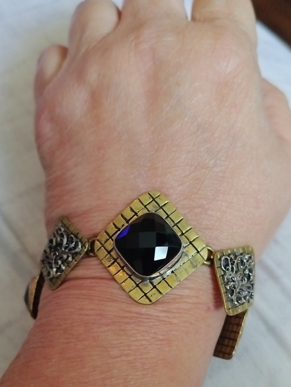 Gold Tone Bracelet with Black Faceted Stone